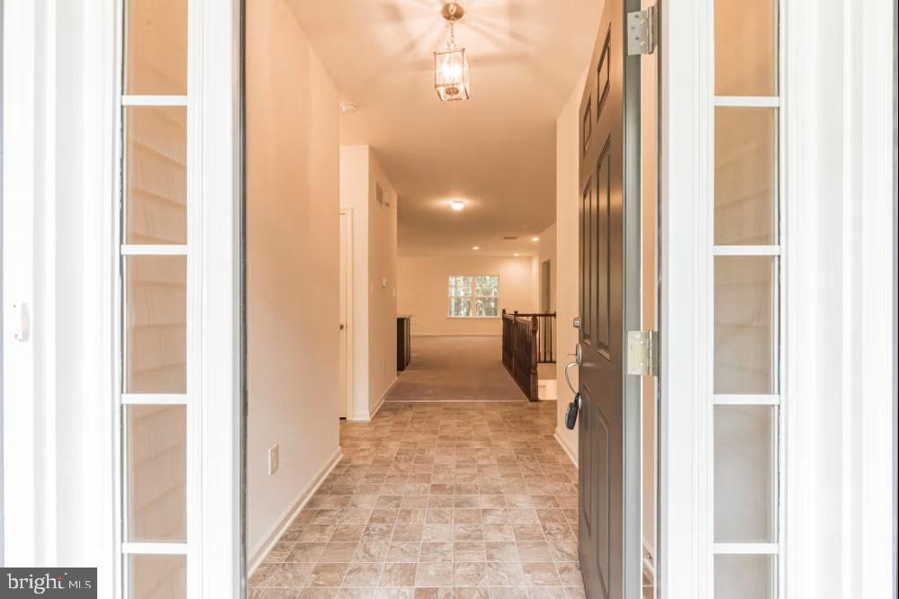 0 Easton Road Ottsville, PA 18942 - Photo 13 of 21 a view of a hallway with wooden floor and a bathroom
