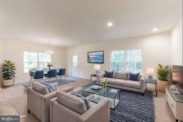 a dining room with furniture window and wooden floor