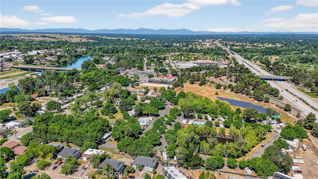 130 Gilmore Road Red Bluff, CA 96080 - Photo 15 of 22 an aerial view of residential houses with outdoor space and trees