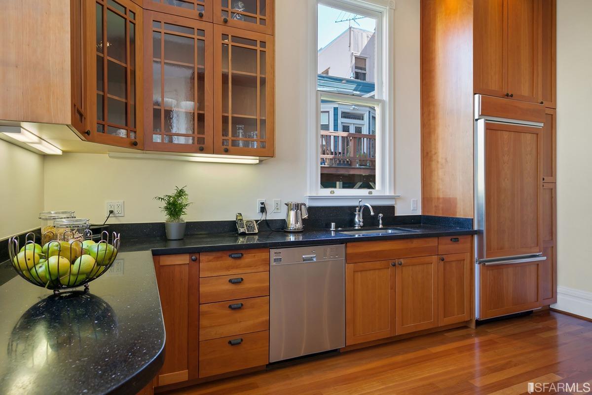Frederick Street San Francisco, CA 94117 - Photo 17 of 61 a kitchen with stainless steel appliances granite countertop a sink and cabinets