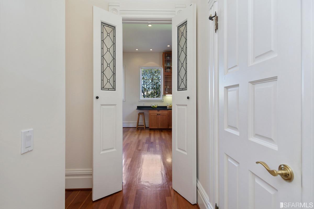 Frederick Street San Francisco, CA 94117 - Photo 23 of 61 a view of a hallway with wooden floor and furniture