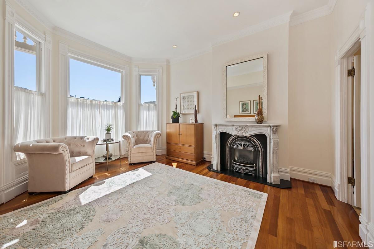 Frederick Street San Francisco, CA 94117 - Photo 27 of 61 a bedroom with furniture and a fireplace