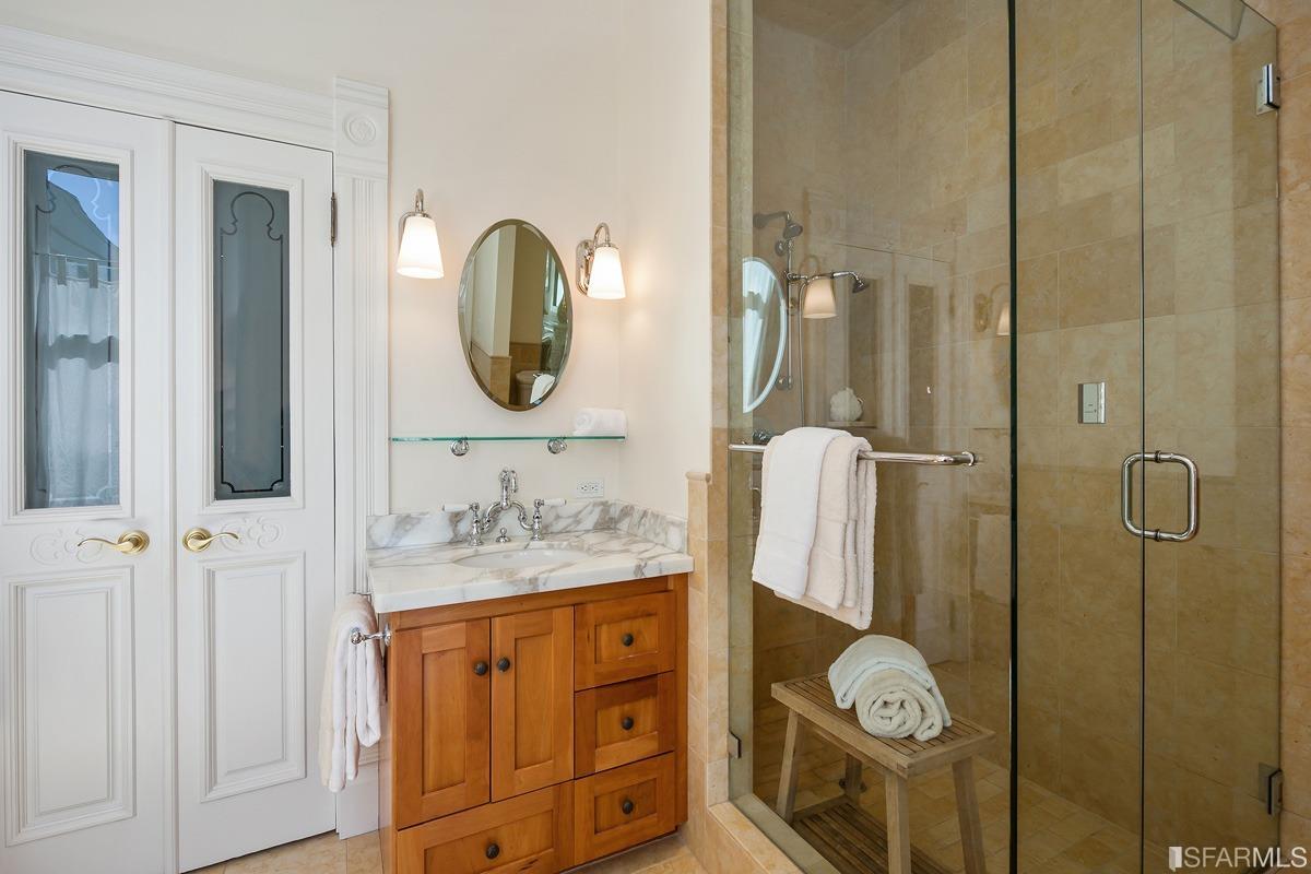 Frederick Street San Francisco, CA 94117 - Photo 33 of 61 a bathroom with a sink vanity and a mirror