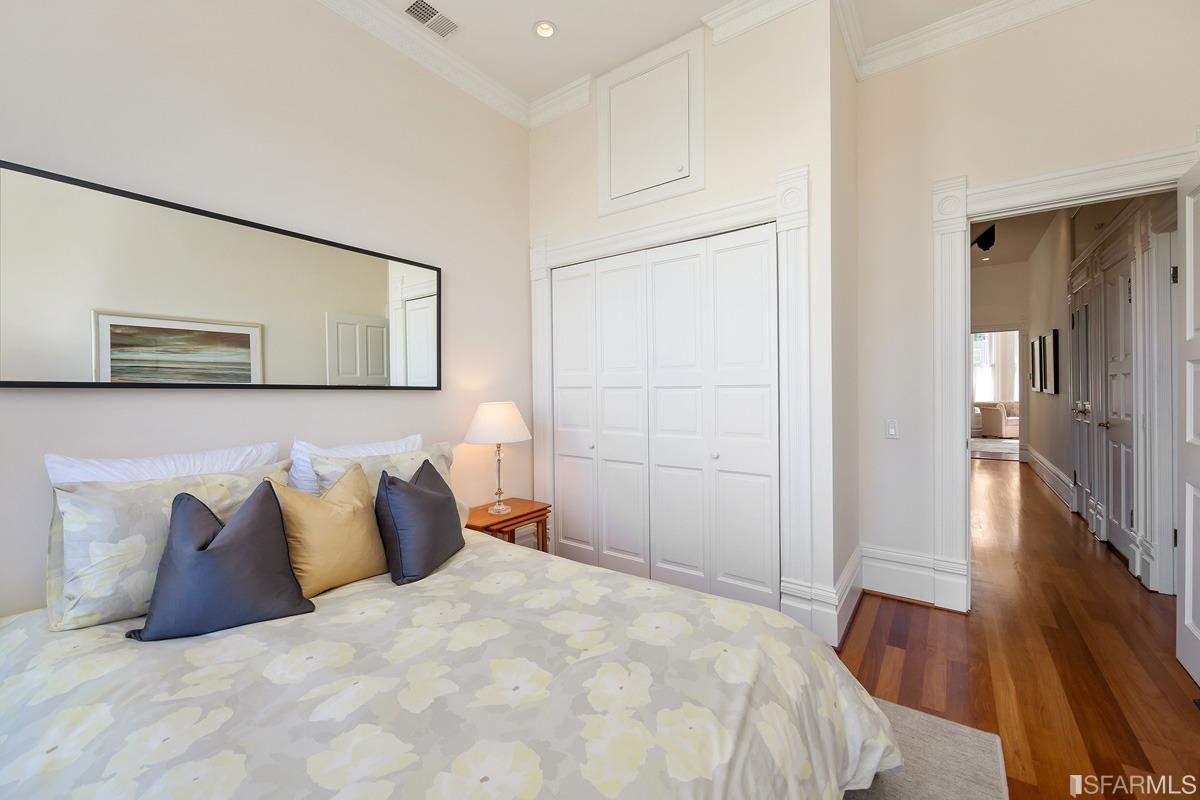 Frederick Street San Francisco, CA 94117 - Photo 36 of 61 a bedroom with a bed and a painting on the wall