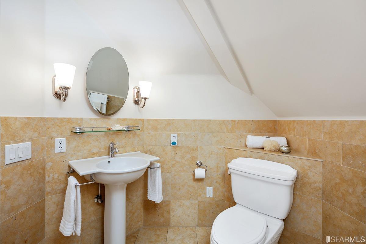 Frederick Street San Francisco, CA 94117 - Photo 48 of 61 a bathroom with a sink and a mirror