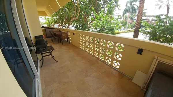 a view of balcony with furniture