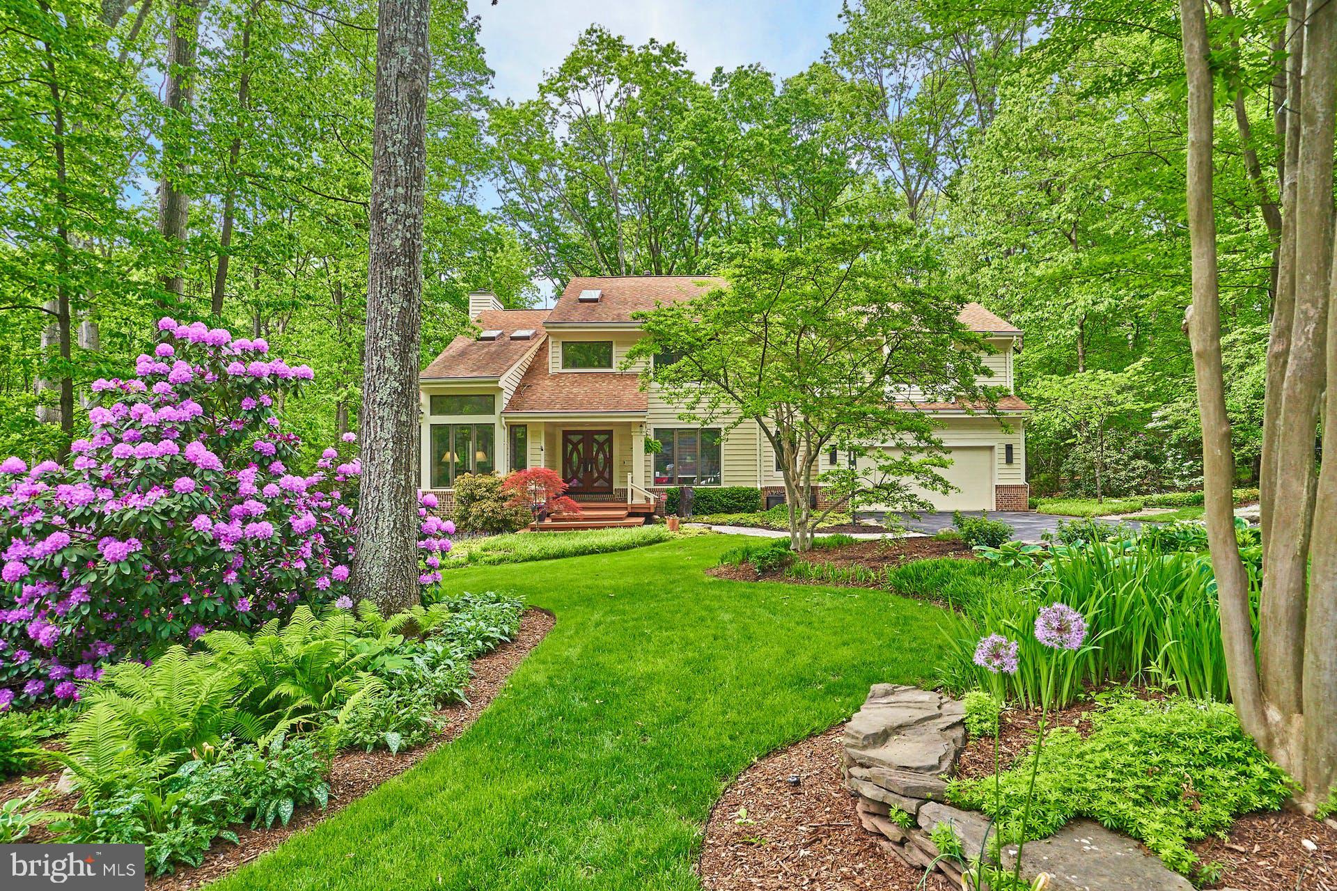 11406 Fieldstone Lane Reston, VA 20191 - Photo 2 of 58 a front view of a house with a garden and pathway