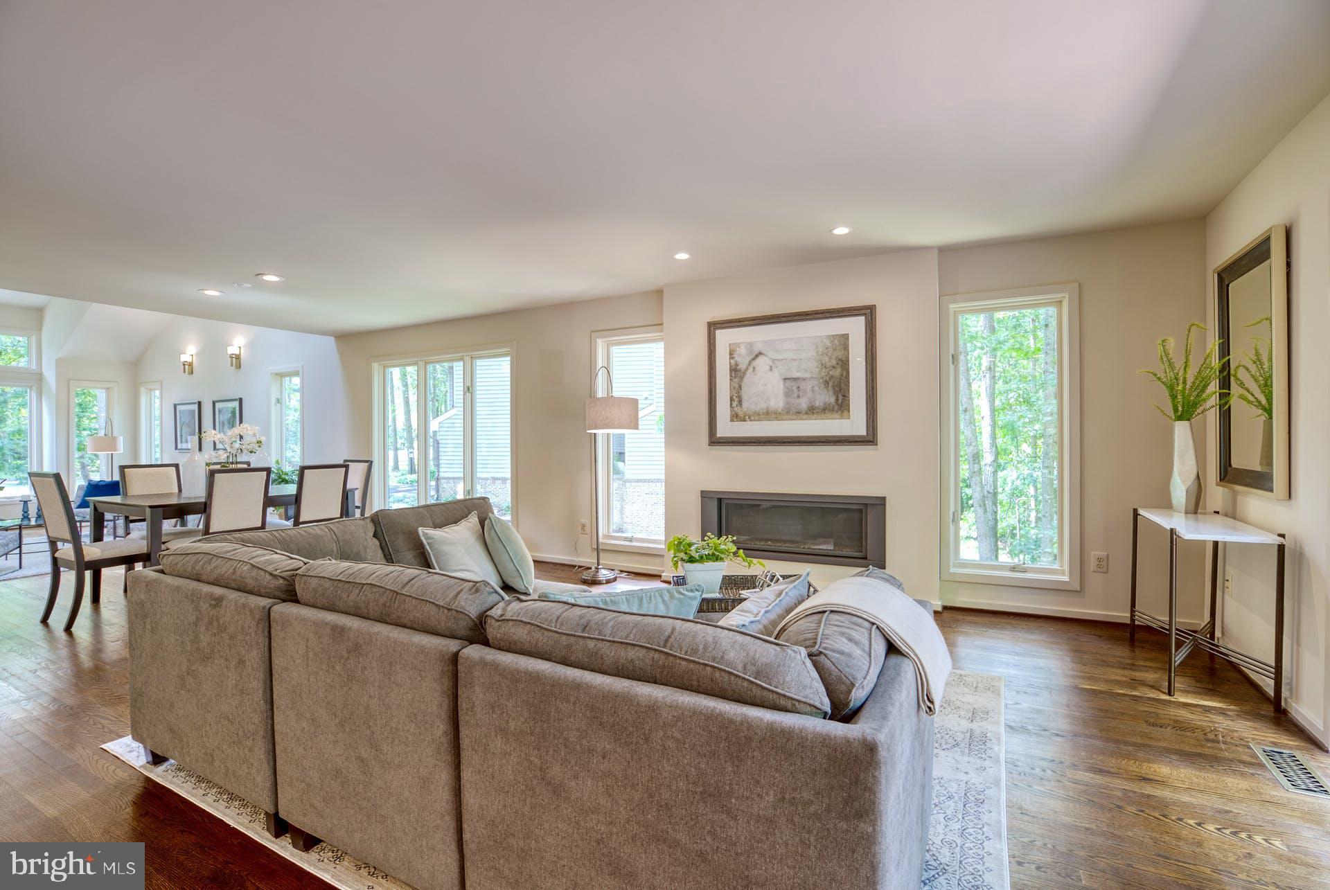 11406 Fieldstone Lane Reston, VA 20191 - Photo 11 of 58 a living room with furniture and a flat screen tv