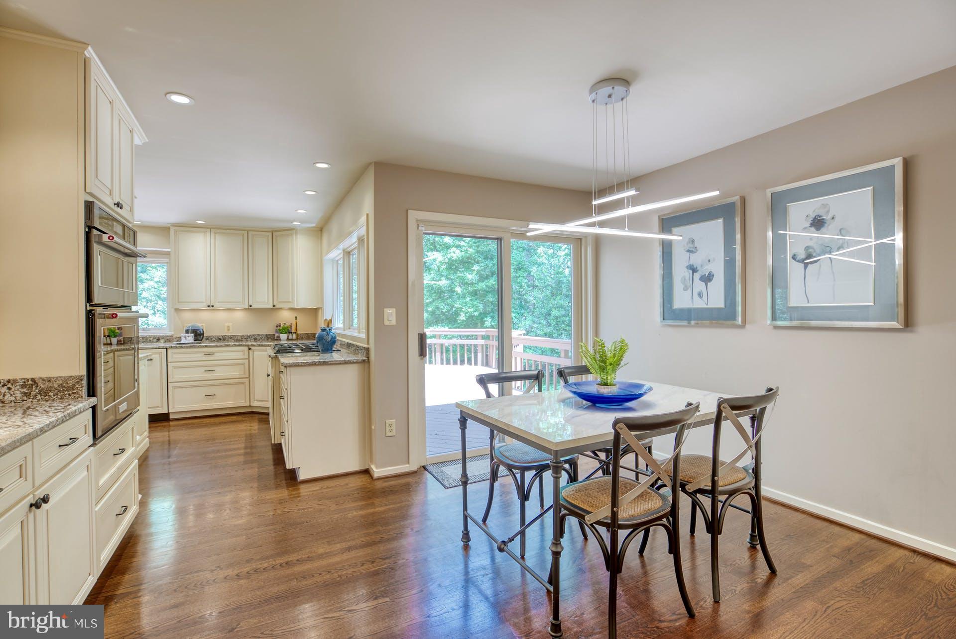 11406 Fieldstone Lane Reston, VA 20191 - Photo 22 of 58 a kitchen with a table and chairs in it