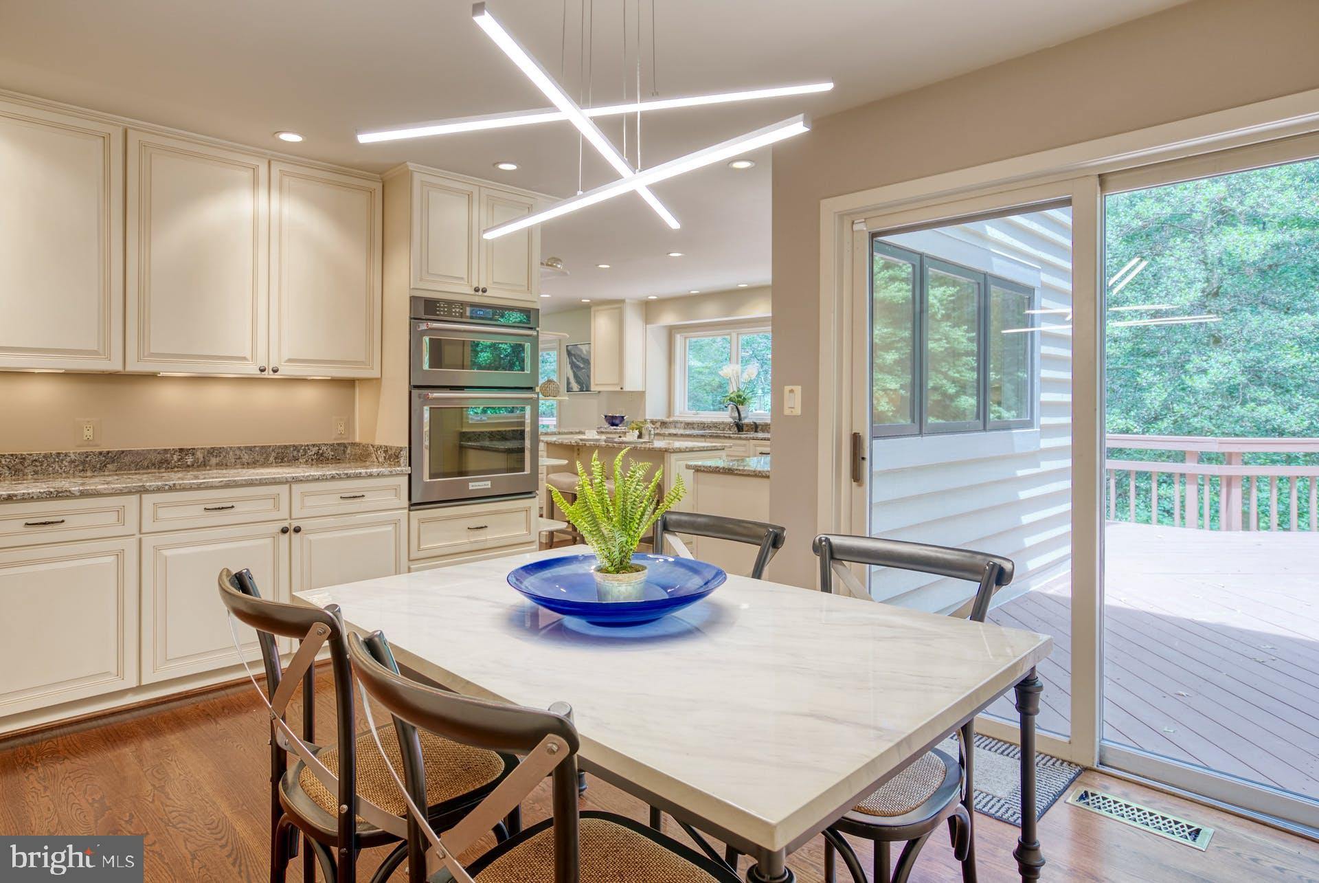 11406 Fieldstone Lane Reston, VA 20191 - Photo 23 of 58 a view of a dining room with furniture window and wooden floor