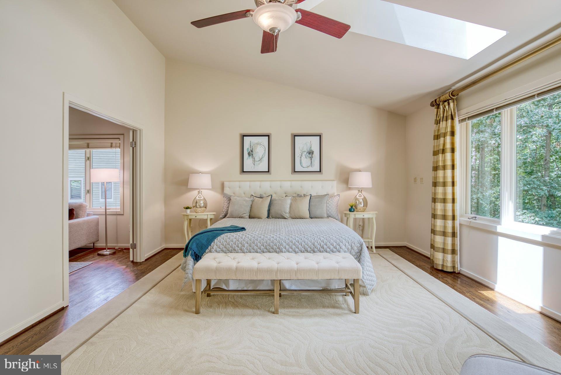 11406 Fieldstone Lane Reston, VA 20191 - Photo 28 of 58 a spacious bedroom with a bed and a large window