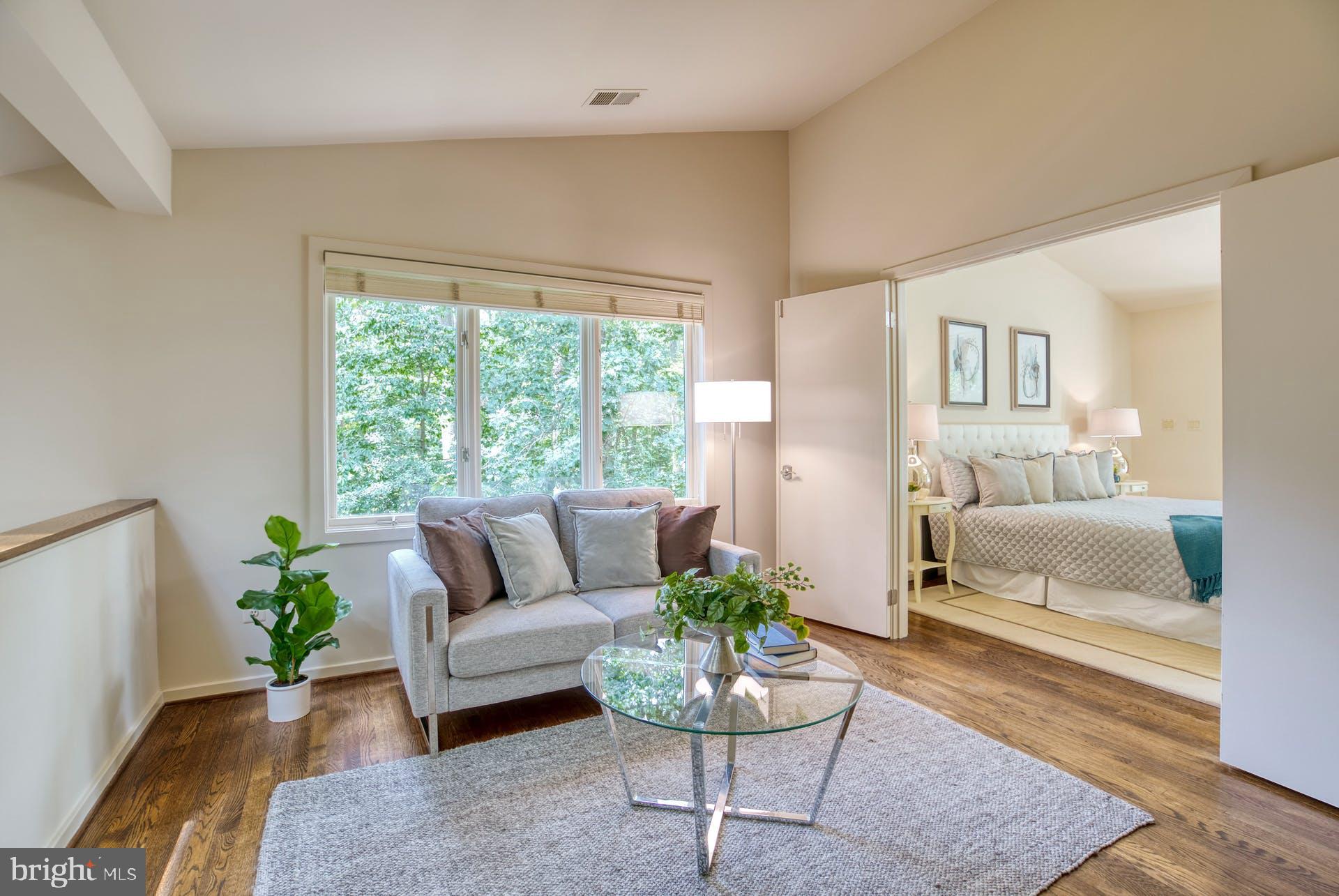 11406 Fieldstone Lane Reston, VA 20191 - Photo 30 of 58 a living room with furniture and a potted plant
