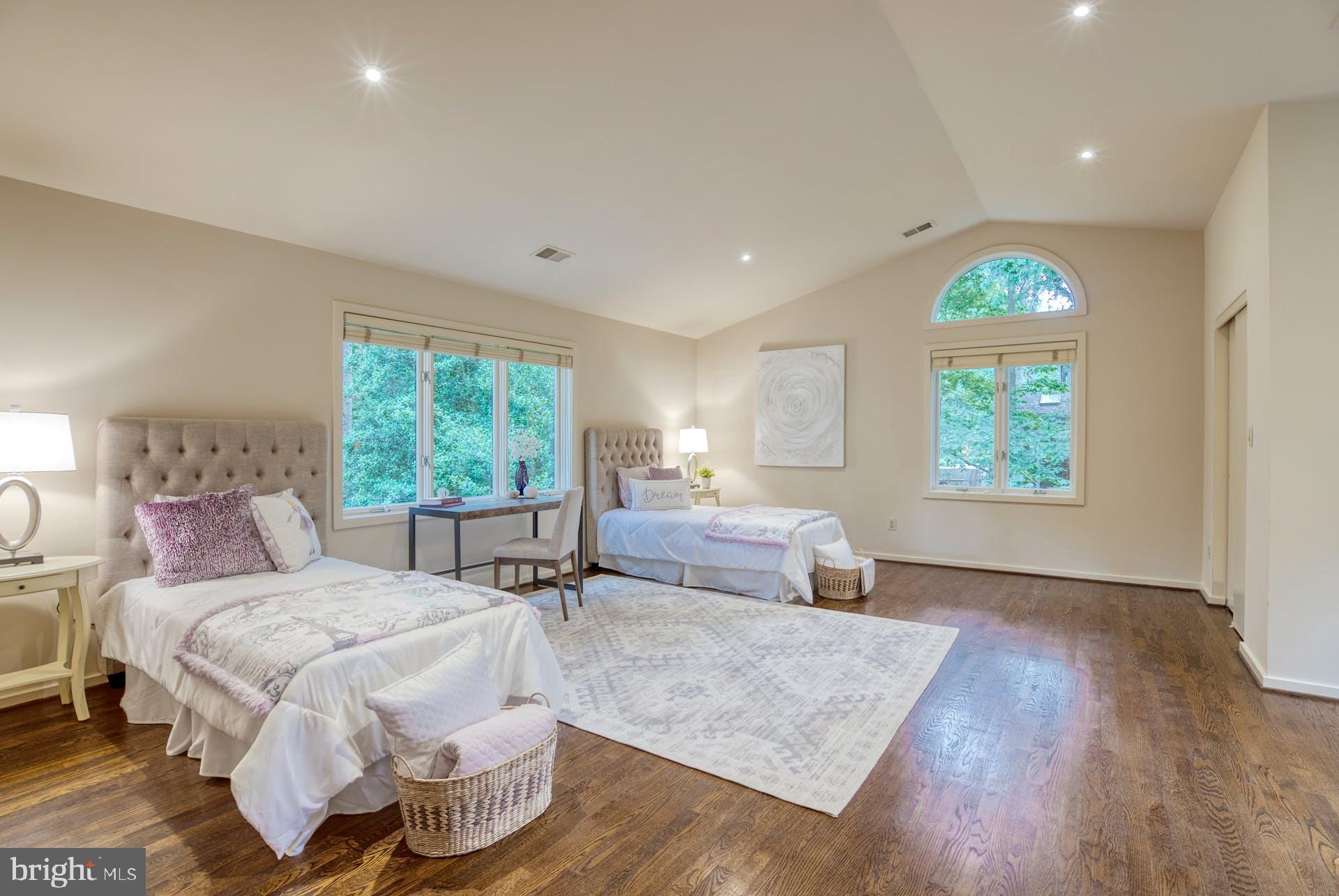 11406 Fieldstone Lane Reston, VA 20191 - Photo 36 of 58 a spacious bedroom with a bed and a large window