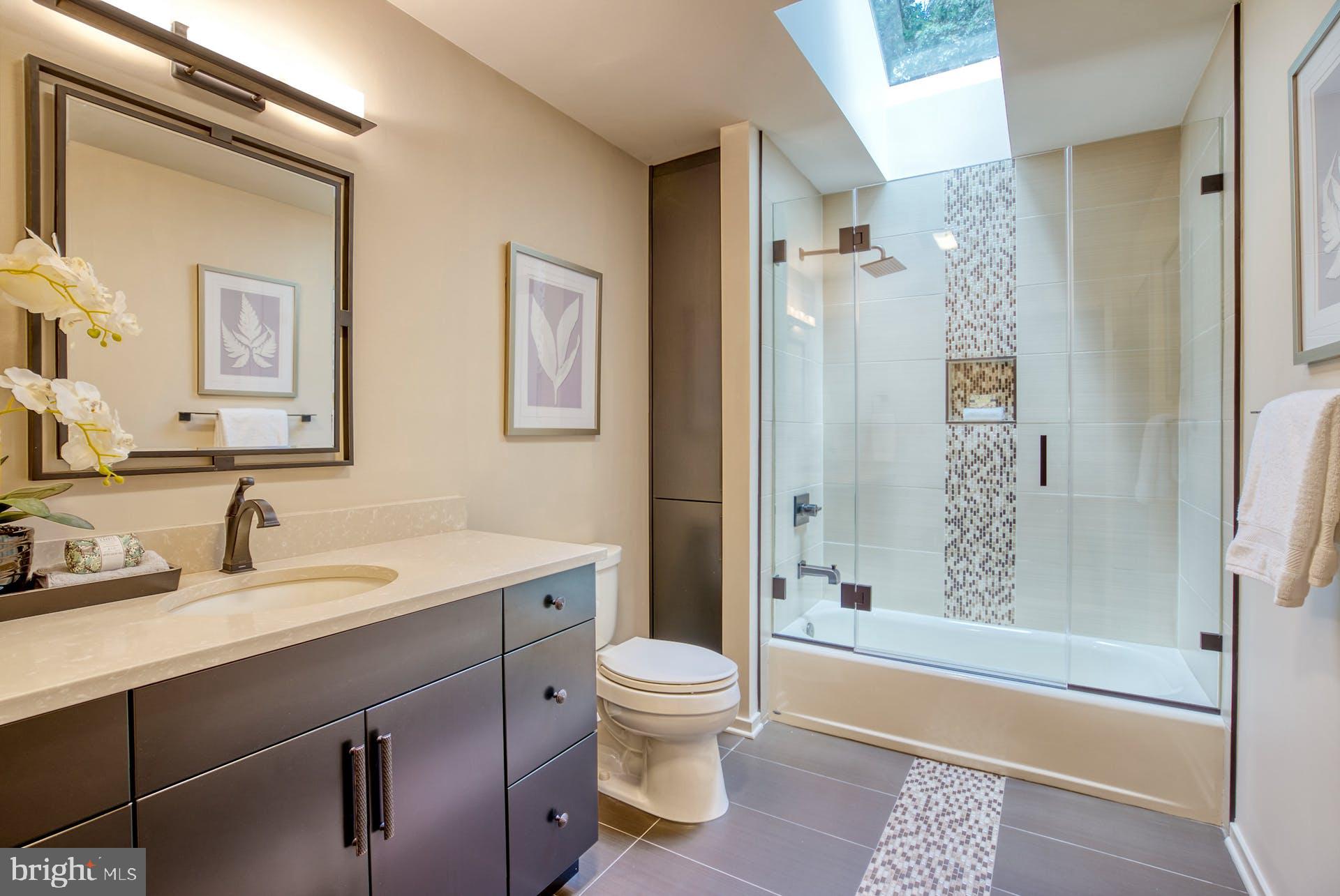 11406 Fieldstone Lane Reston, VA 20191 - Photo 38 of 58 a bathroom with a sink a toilet and shower