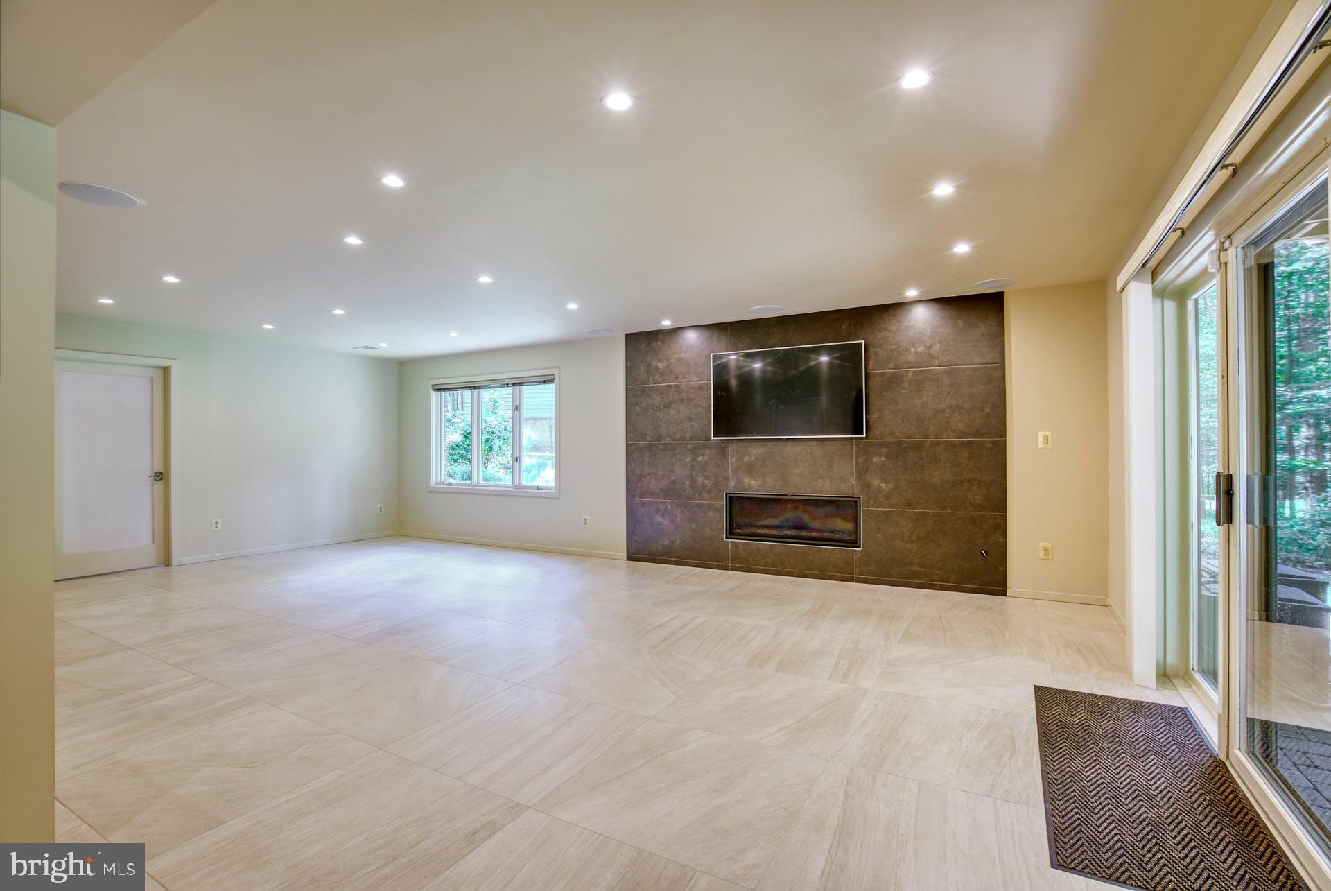 11406 Fieldstone Lane Reston, VA 20191 - Photo 43 of 58 a view of an empty room with a window and a kitchen