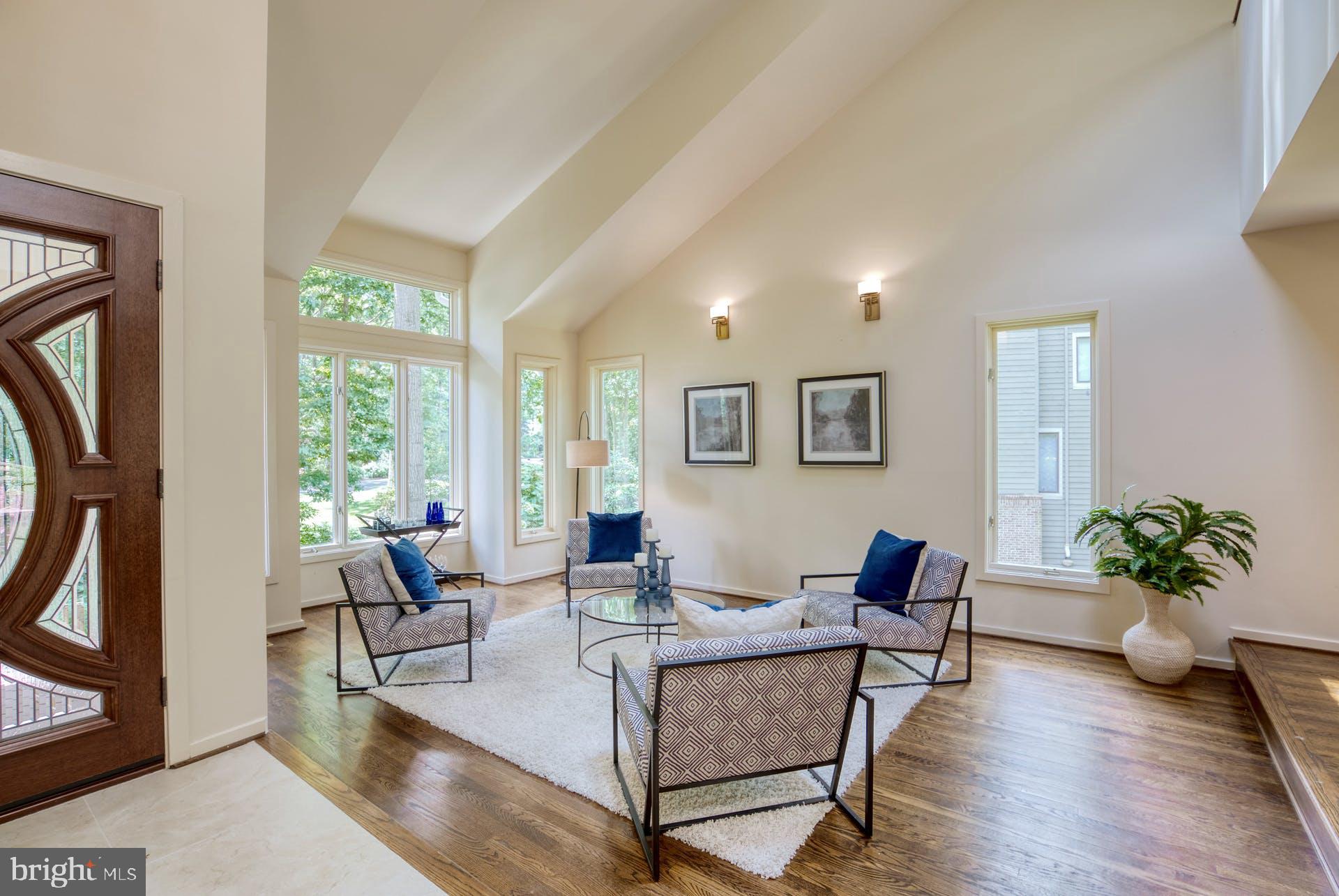 11406 Fieldstone Lane Reston, VA 20191 - Photo 6 of 58 a living room with furniture potted plant a window and a potted plant