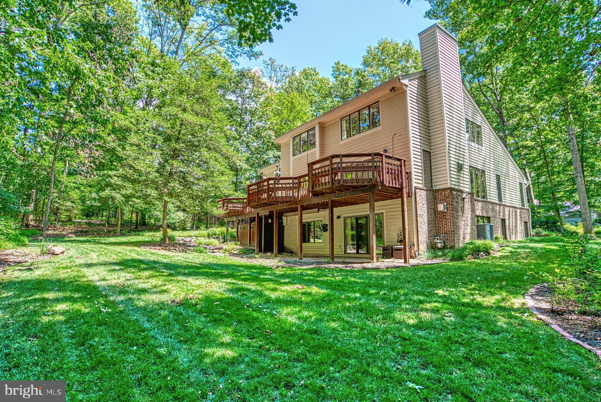 11406 Fieldstone Lane Reston, VA 20191 - Photo 51 of 58 a front view of a house with a yard