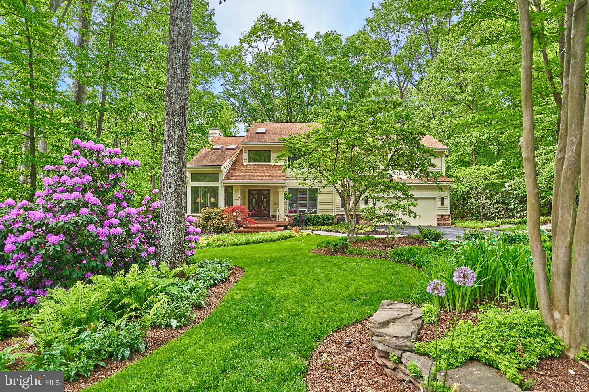 11406 Fieldstone Lane Reston, VA 20191 - Photo 58 of 58 a front view of a house with a garden and pathway