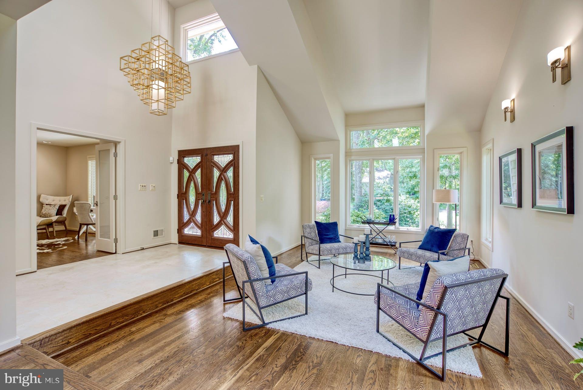 11406 Fieldstone Lane Reston, VA 20191 - Photo 7 of 58 a living room with fireplace furniture and a large window