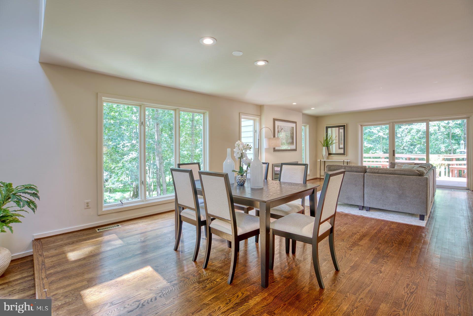11406 Fieldstone Lane Reston, VA 20191 - Photo 9 of 58 a view of a dining room with furniture window and wooden floor