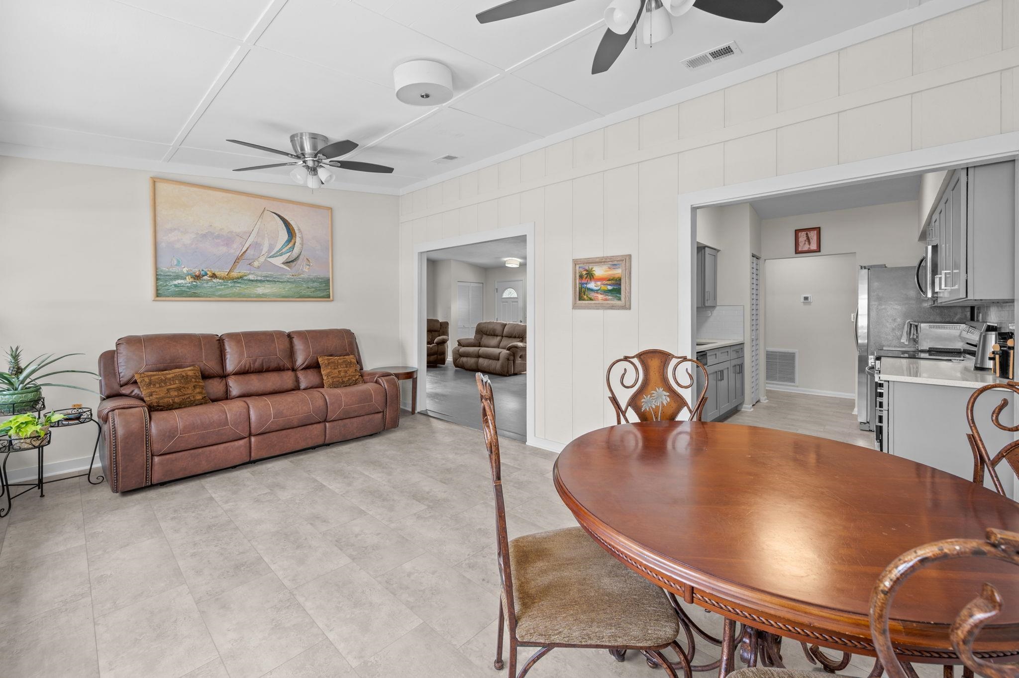 507 Gentian Road St. Augustine, FL 32086 - Photo 8 of 82 a living room with furniture a dining table and kitchen view