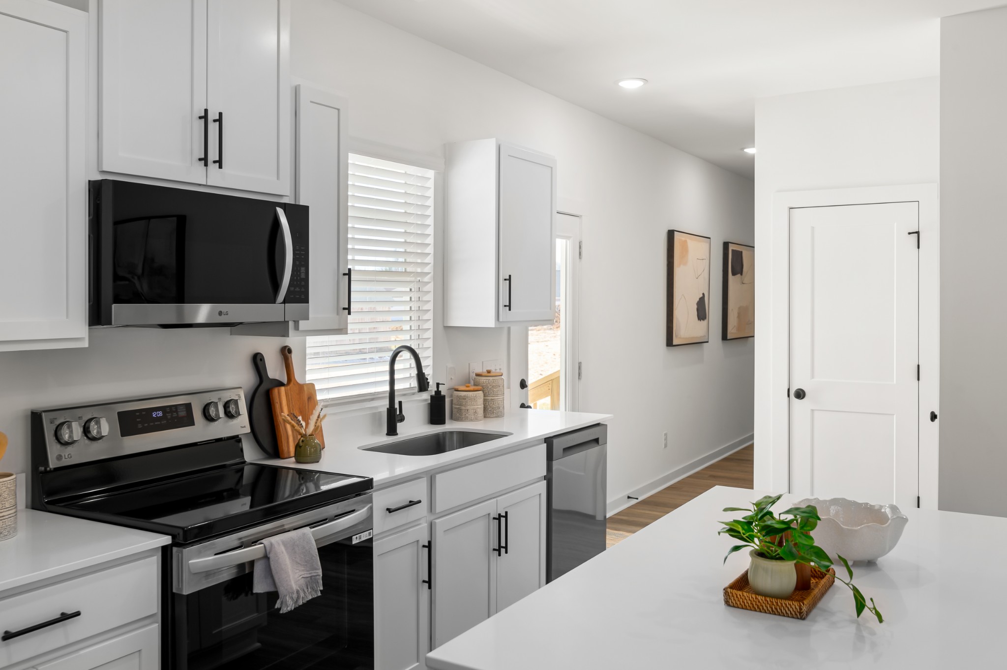 218 Reece Road Baxter, TN 38544 - Photo 6 of 16 a kitchen that has a sink and a stove top oven