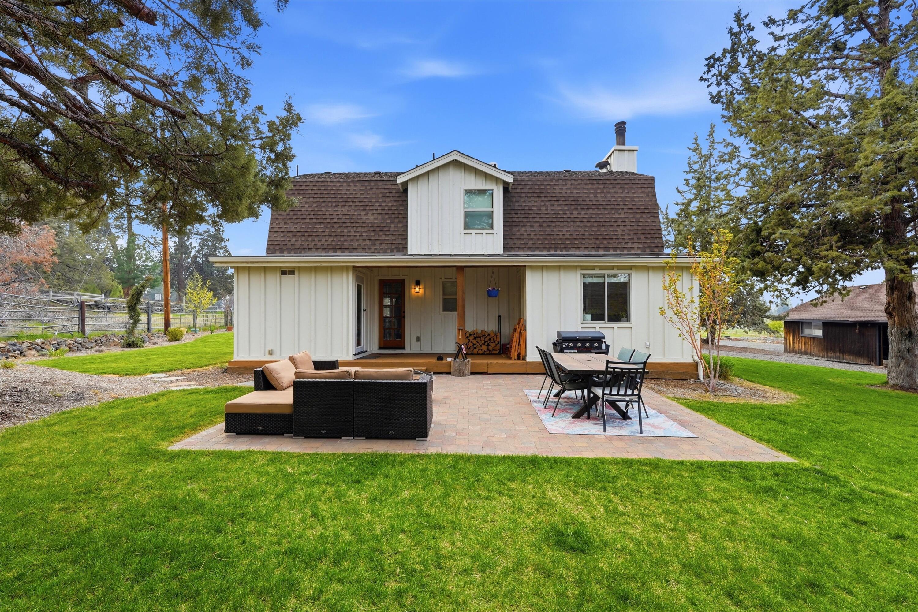 61280 Larsen Road Bend, OR 97702 - Photo 26 of 58 a view of a house with a patio