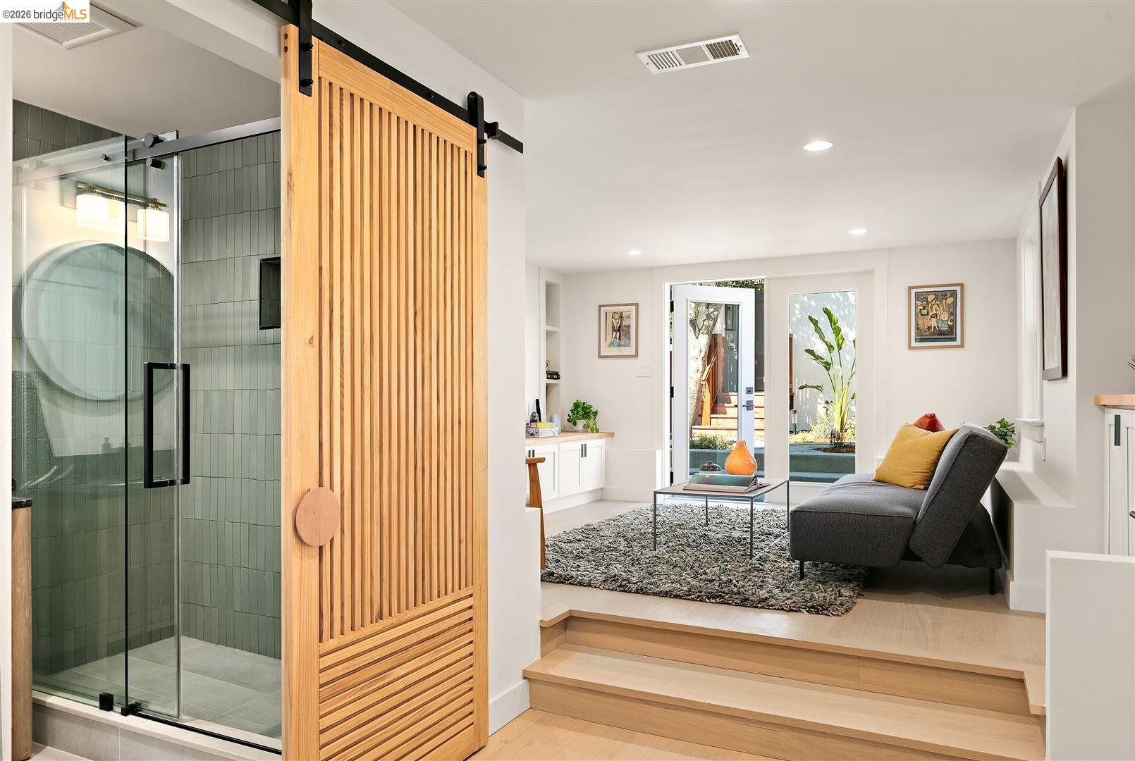1668 Arch Street Berkeley, CA 94709 - Photo 42 of 78 Wood-finish flooring with integrated steps, recessed lighting, and white walls