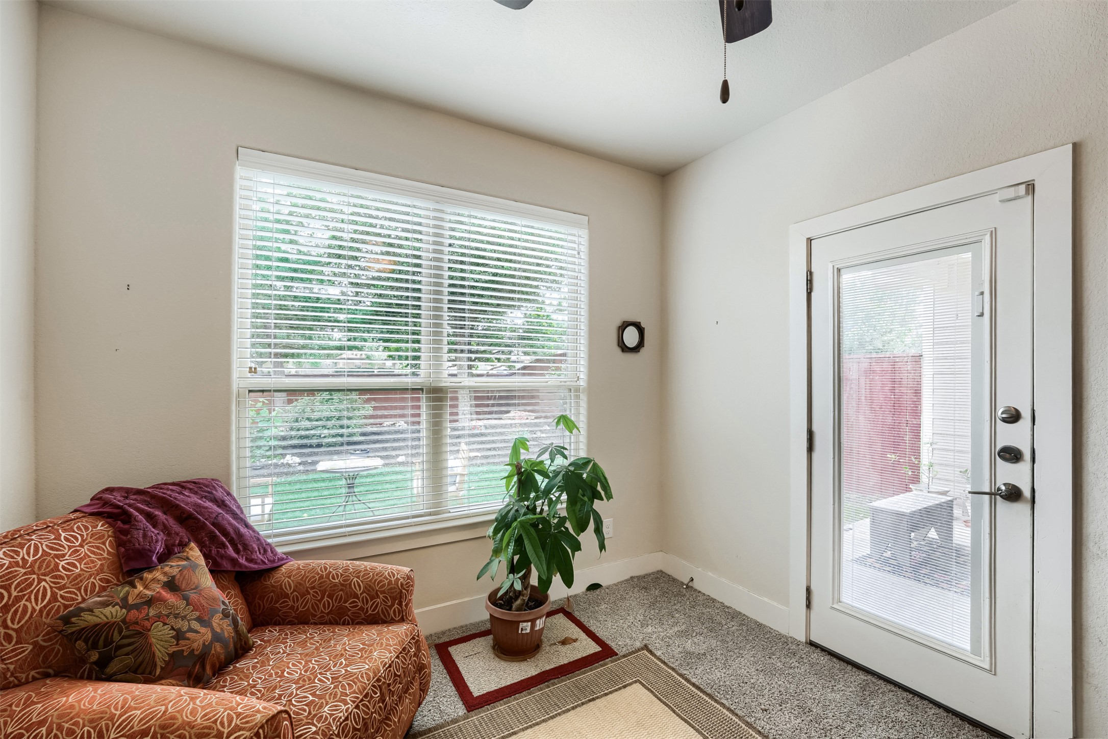 418 High Tech Drive Georgetown, TX 78626 - Photo 19 of 34 Carpeted interior space featuring a large window with blinds and a glass-paneled door