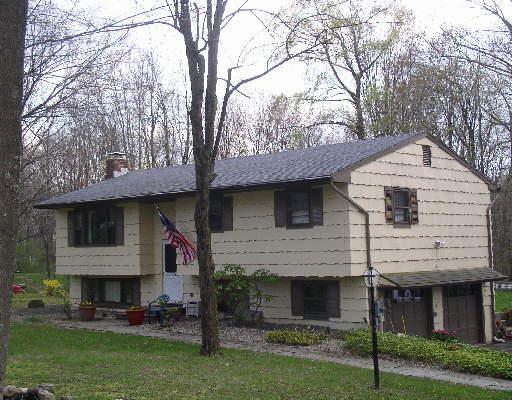 3 Corn Tassle Road Danbury, CT 06811 - Photo 1 of 1 a front view of a house with a yard