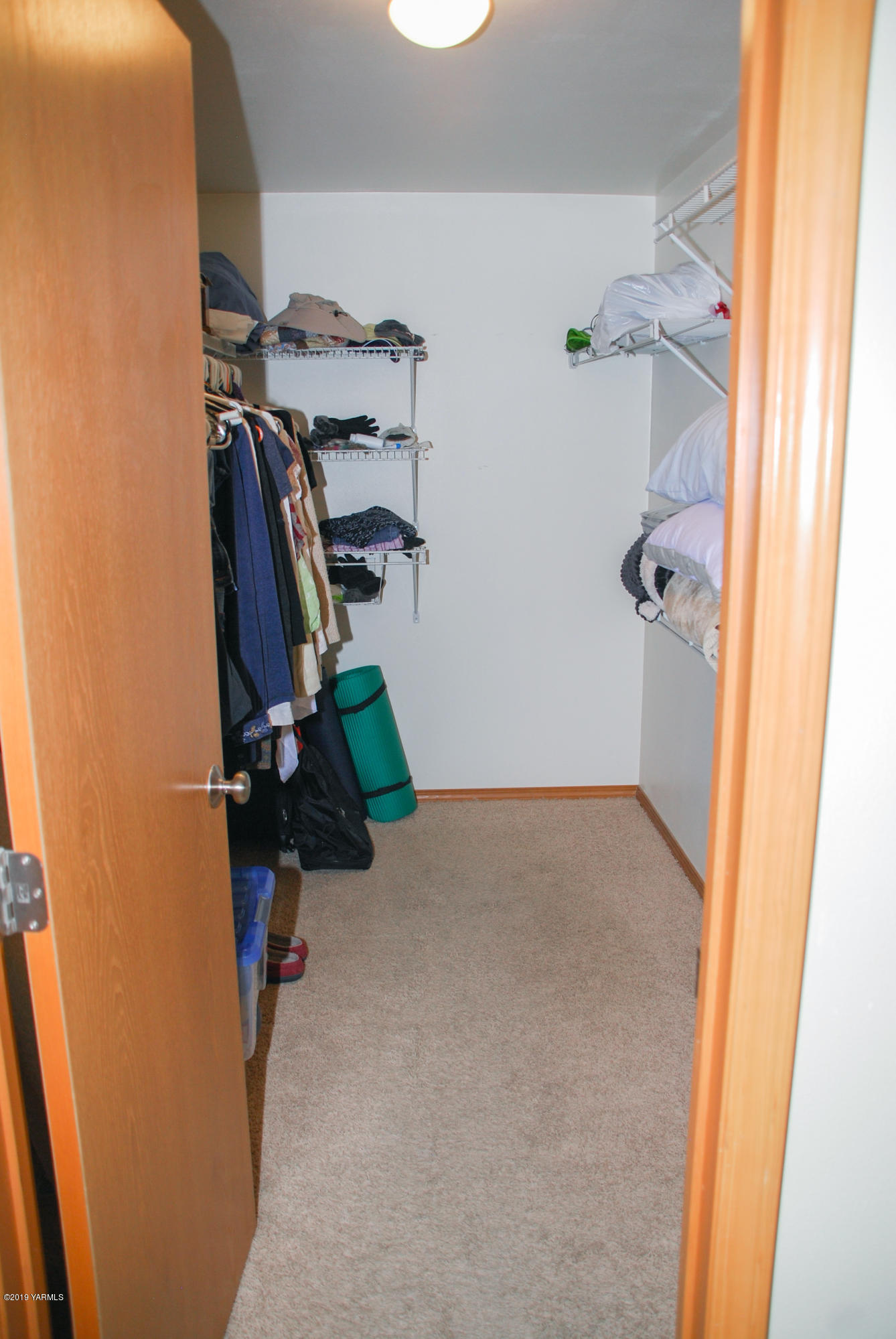 1271 North Granger Road Zillah, WA 98953 - Photo 17 of 30 a view of walk in closet with clothes and shoes
