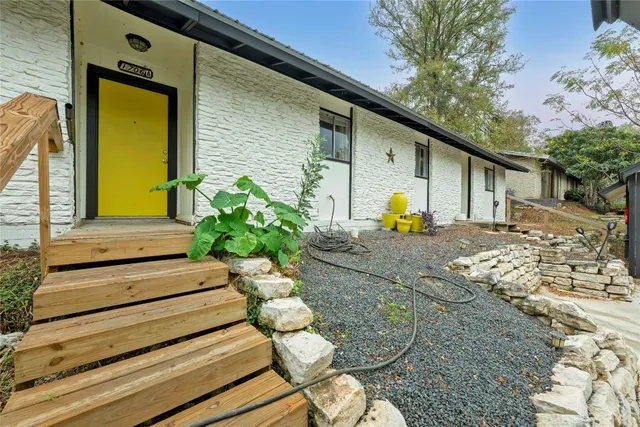 a view of a two chairs in the patio