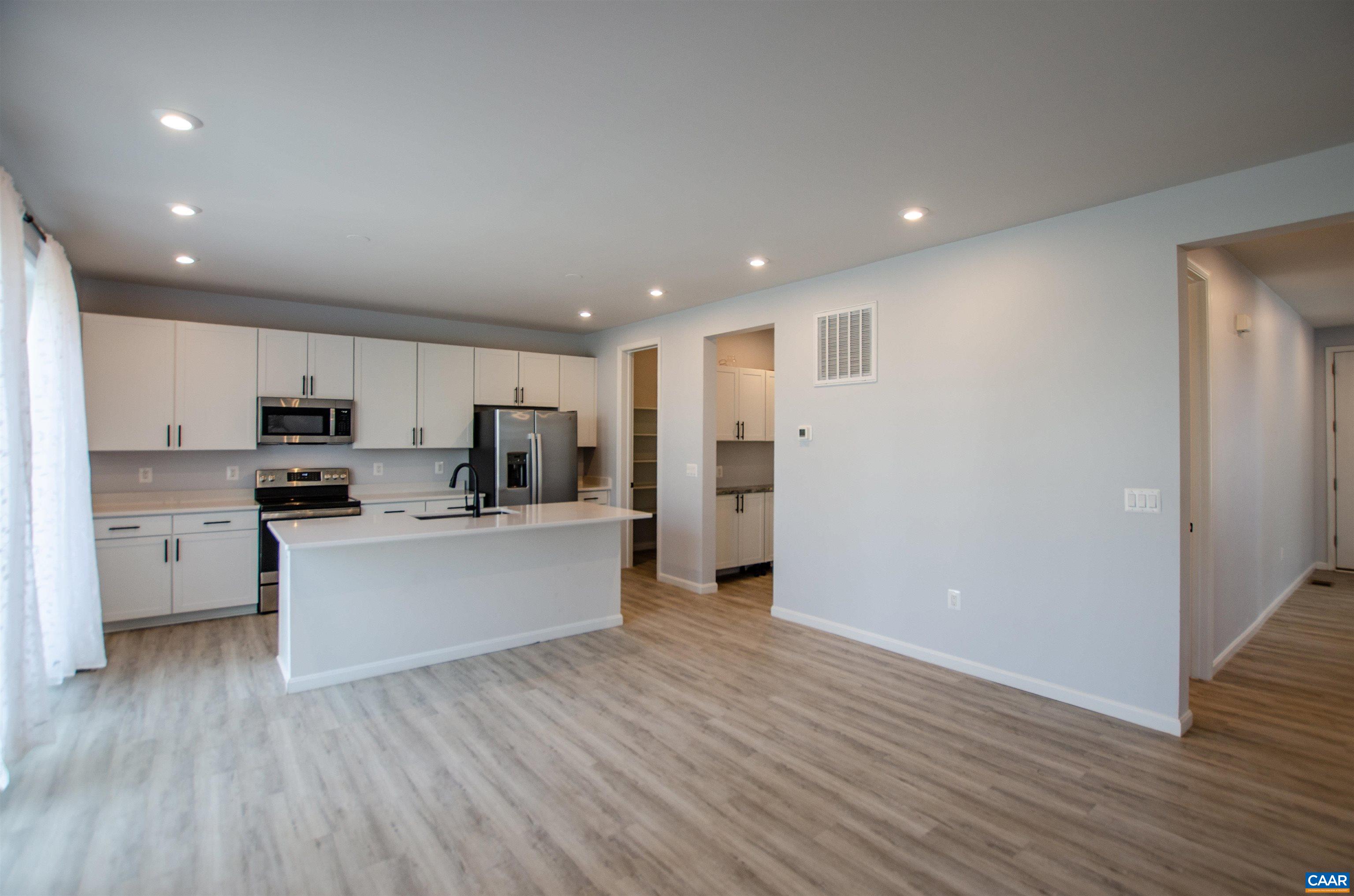 403 Meadows Drive Orange, VA 22960 - Photo 15 of 50 a kitchen with stainless steel appliances refrigerator sink and cabinets
