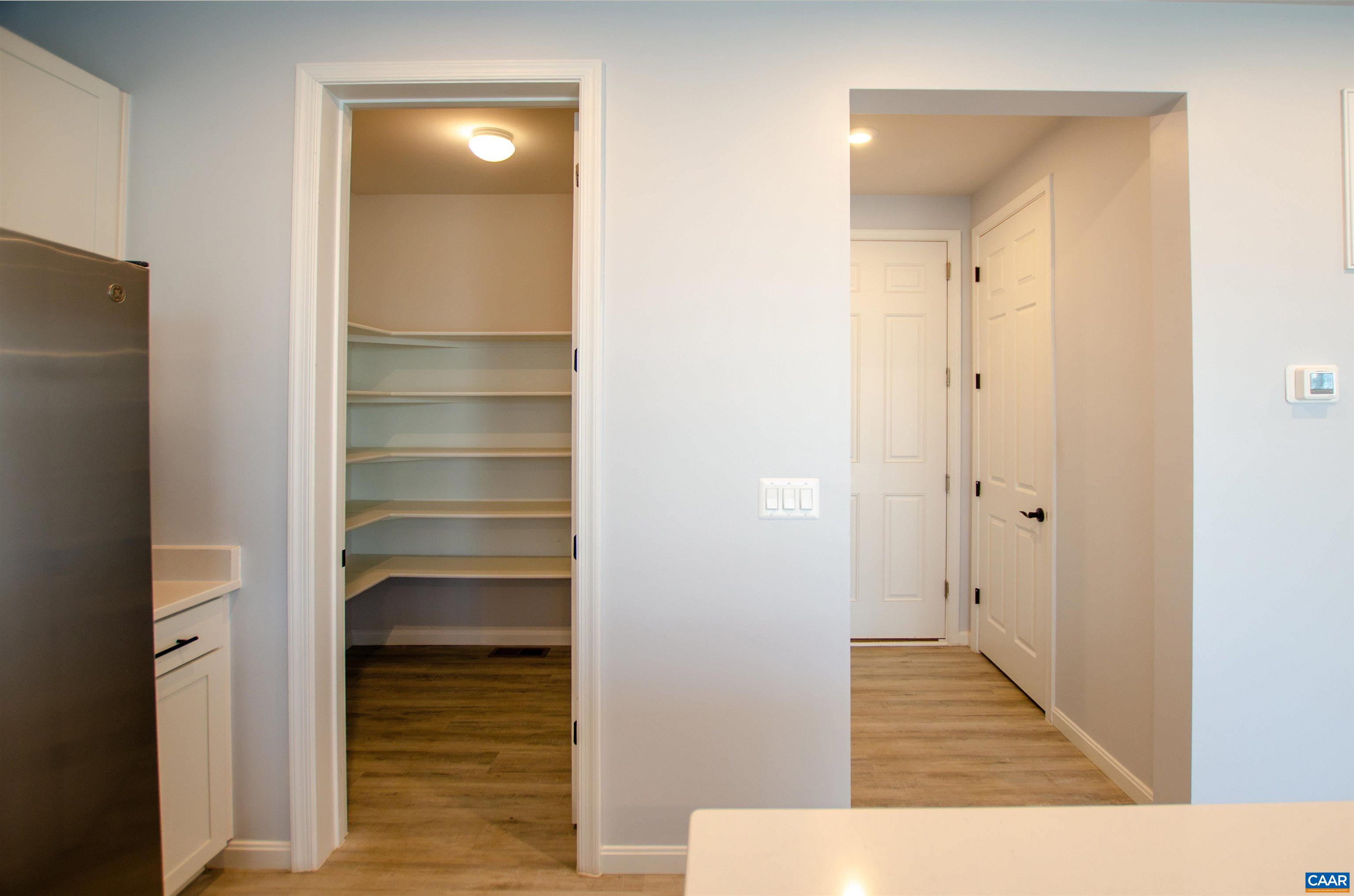 403 Meadows Drive Orange, VA 22960 - Photo 18 of 50 a view of a hallway with wooden floor and staircase