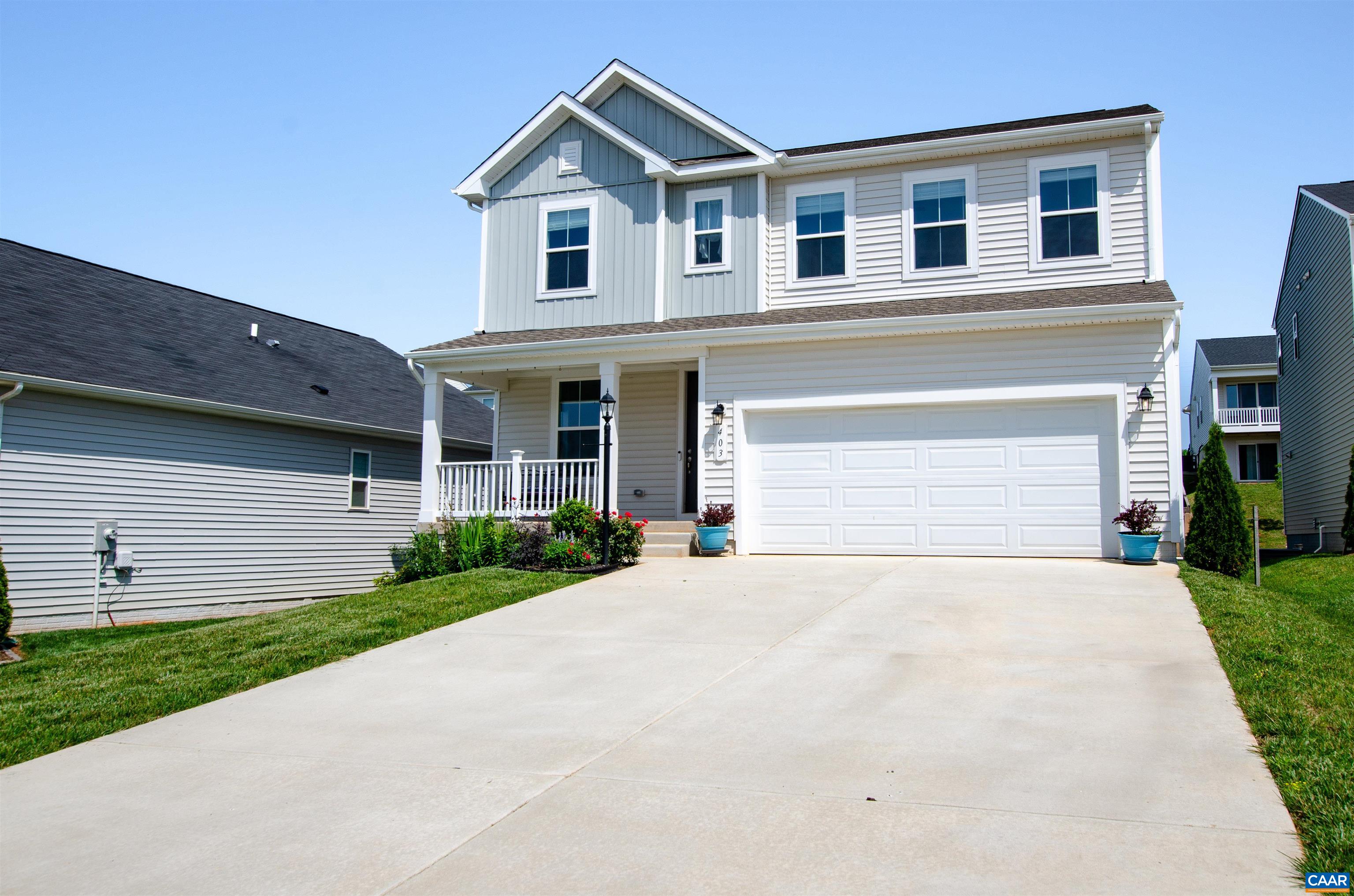 403 Meadows Drive Orange, VA 22960 - Photo 2 of 50 a front view of a house with a yard and garage