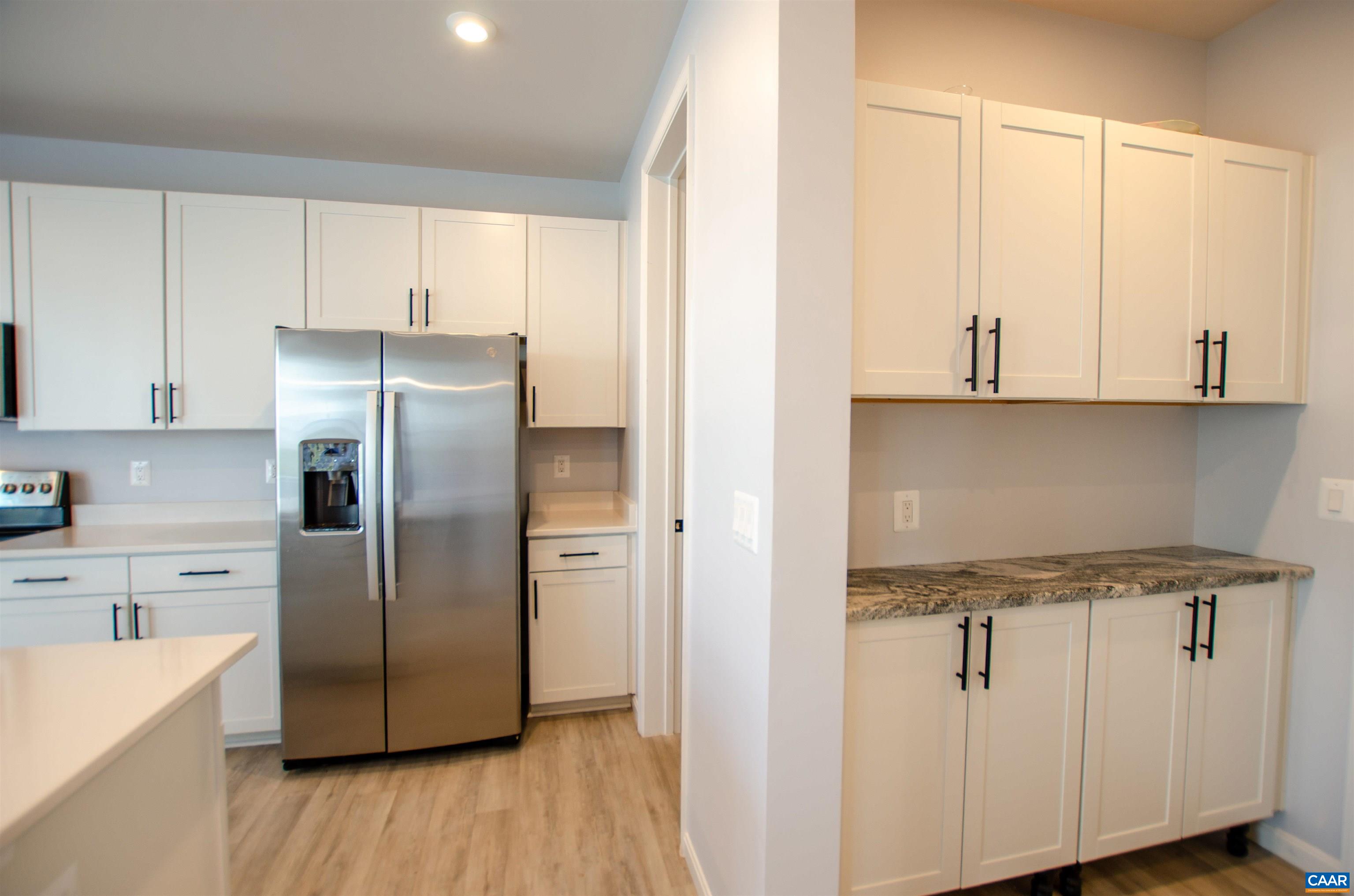 403 Meadows Drive Orange, VA 22960 - Photo 21 of 50 a kitchen with stainless steel appliances white cabinets and a refrigerator