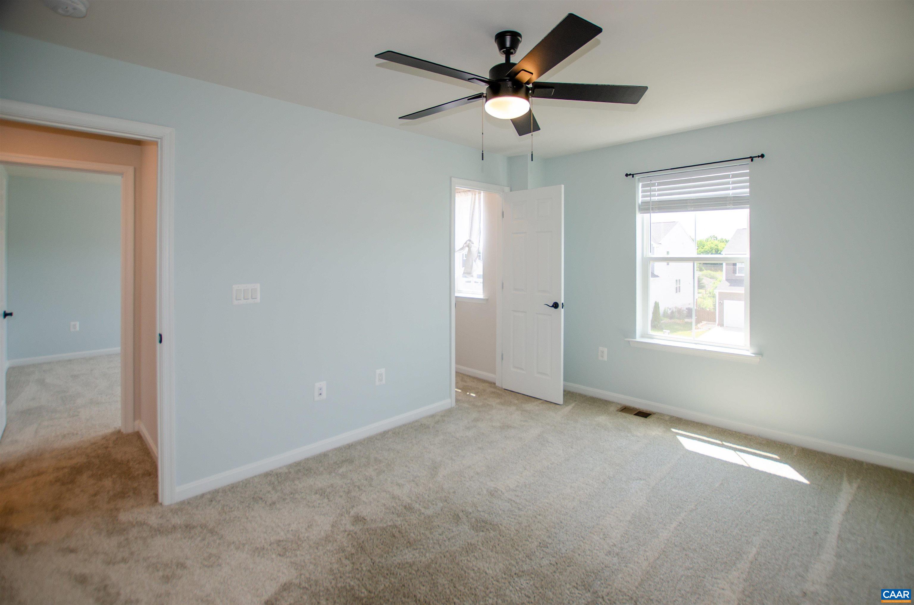 403 Meadows Drive Orange, VA 22960 - Photo 41 of 50 an empty room with a window and a fan