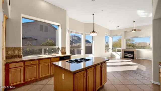 a kitchen with stainless steel appliances granite countertop a stove and a refrigerator
