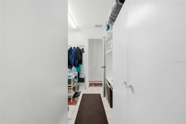 a bed room with a bed and a chandelier