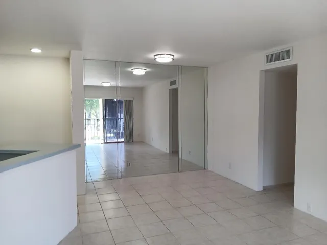 a view of livingroom with an empty space and a window