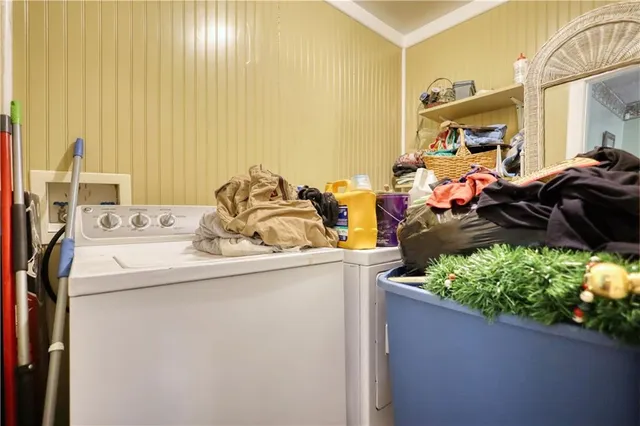 a kitchen with a sink a stove cabinets and wooden floor