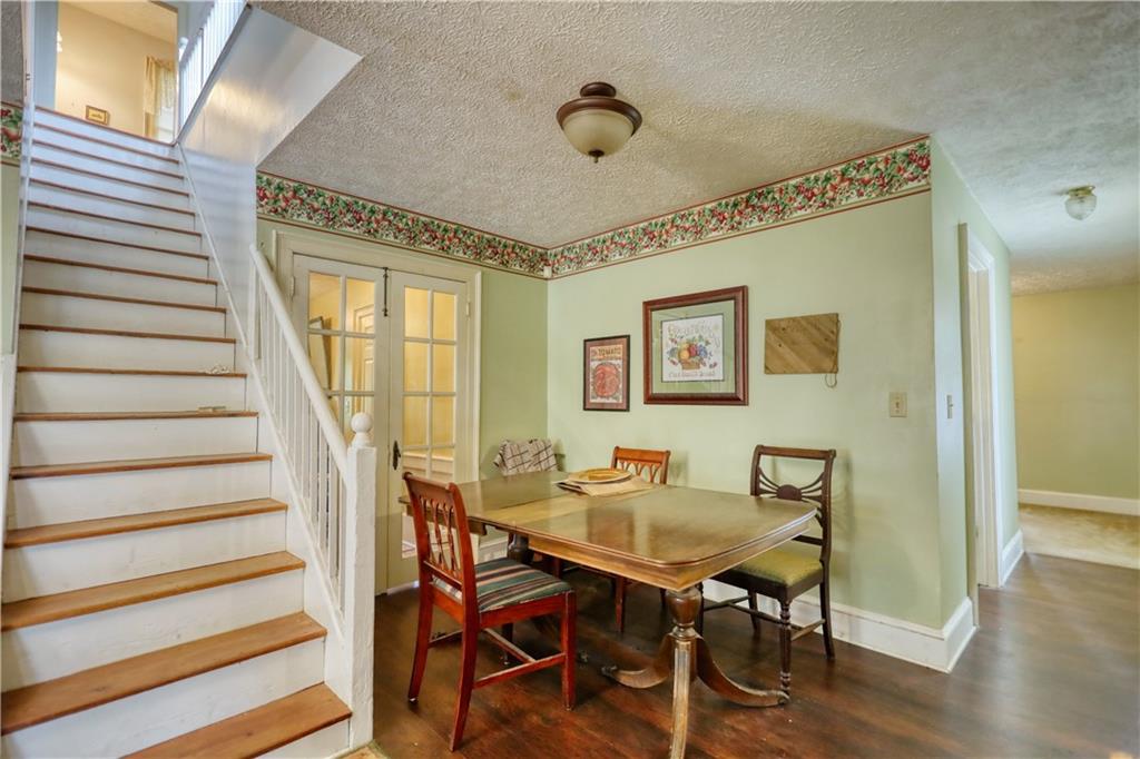 5011 Penfield Road Union Point, GA 30669 - Photo 24 of 68 a view of a dining room with furniture and wooden floor
