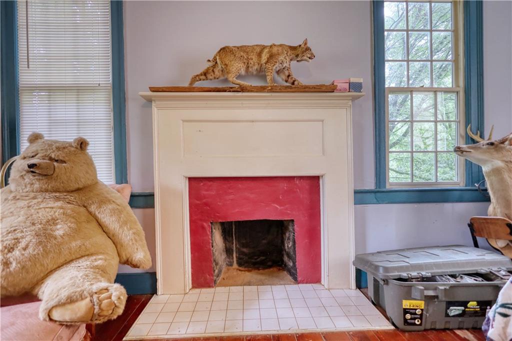 5011 Penfield Road Union Point, GA 30669 - Photo 36 of 68 a living room with furniture and a fireplace
