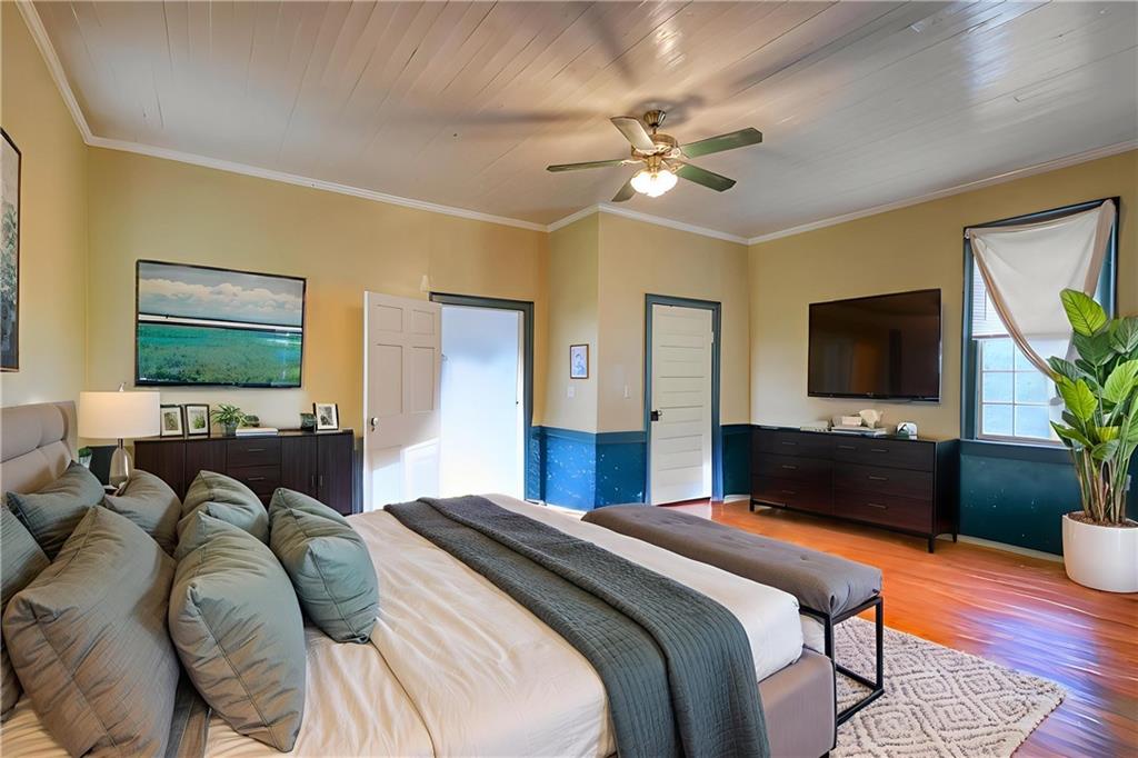 5011 Penfield Road Union Point, GA 30669 - Photo 43 of 68 a bedroom with a bed and a flat screen tv