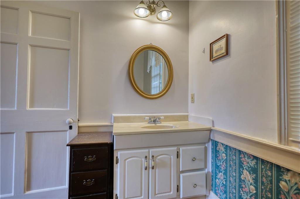 5011 Penfield Road Union Point, GA 30669 - Photo 47 of 68 a bathroom with a sink and a mirror