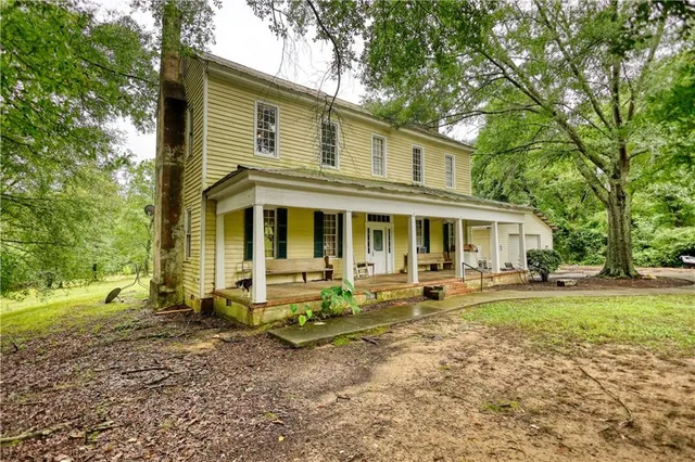 a front view of a house with garden