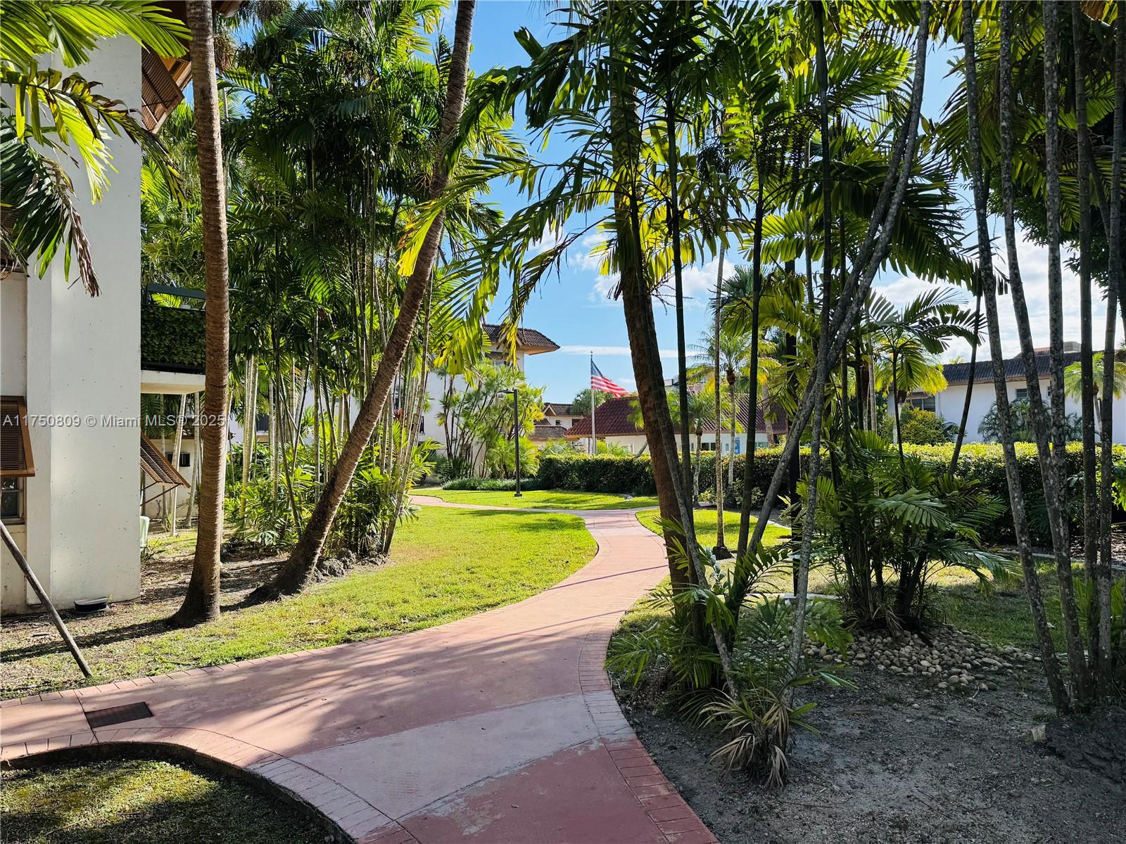 9394 Southwest 77th Avenue, Unit F1 Miami, FL 33156 - Photo 18 of 24 a view of a park with trees