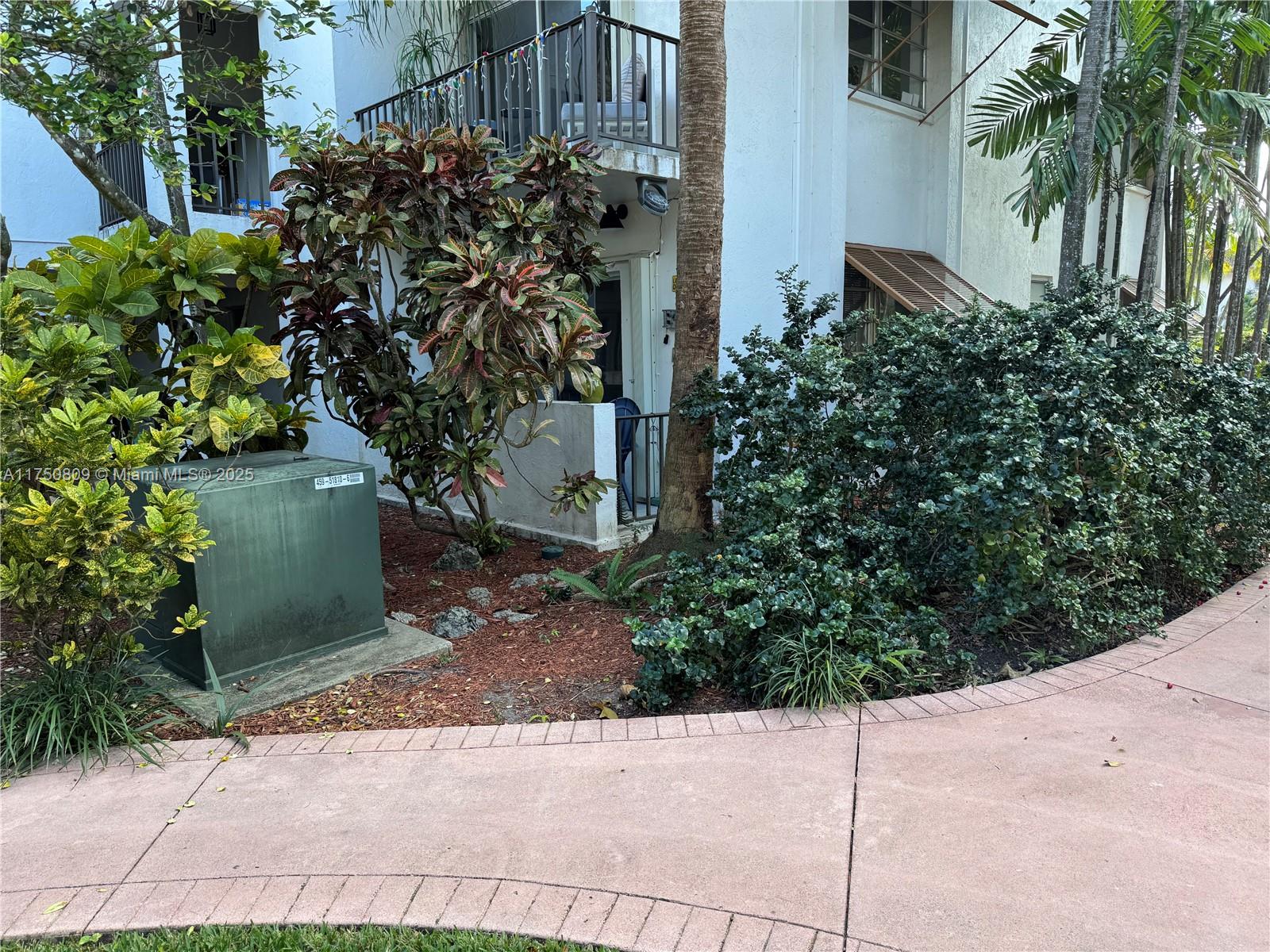 9394 Southwest 77th Avenue, Unit F1 Miami, FL 33156 - Photo 20 of 24 a plant that is in front of a building