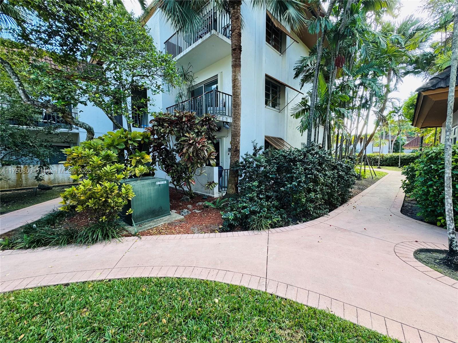 9394 Southwest 77th Avenue, Unit F1 Miami, FL 33156 - Photo 21 of 24 a view of a garden with plants