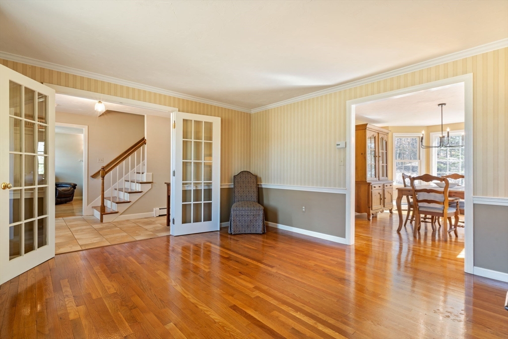21 Worcester Road Norfolk, MA 02056 - Photo 15 of 40 a living room with furniture and a table with wooden floor